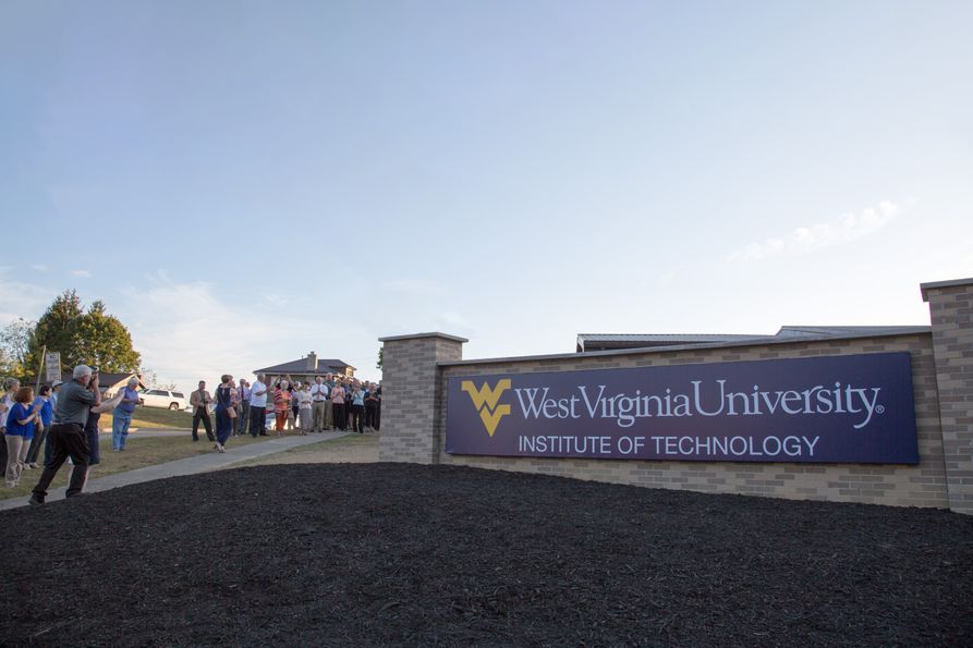 People gather for the unveiling of the new Beckley campus Welcome Wall