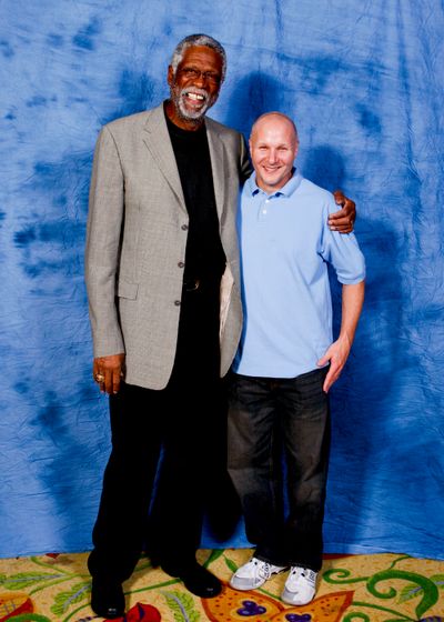 Mike McClellan stands with basketball legend, Bill Russell.