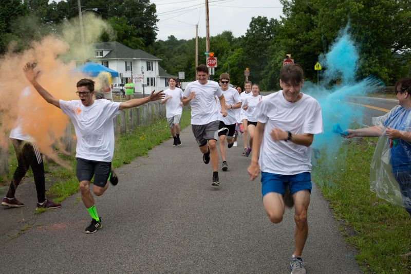 Student participate in the color run at the Upward Bound Olympics