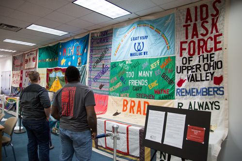 Students view portions of the famed NAMES Project AIDS Memorial Quilt.