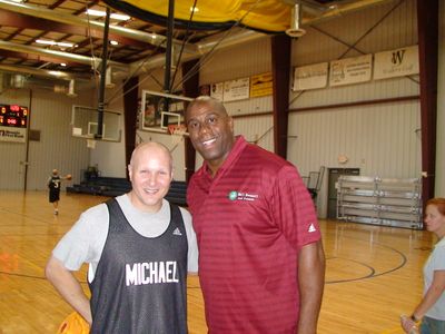 Michael at a basketball camp with Magic Johnson.